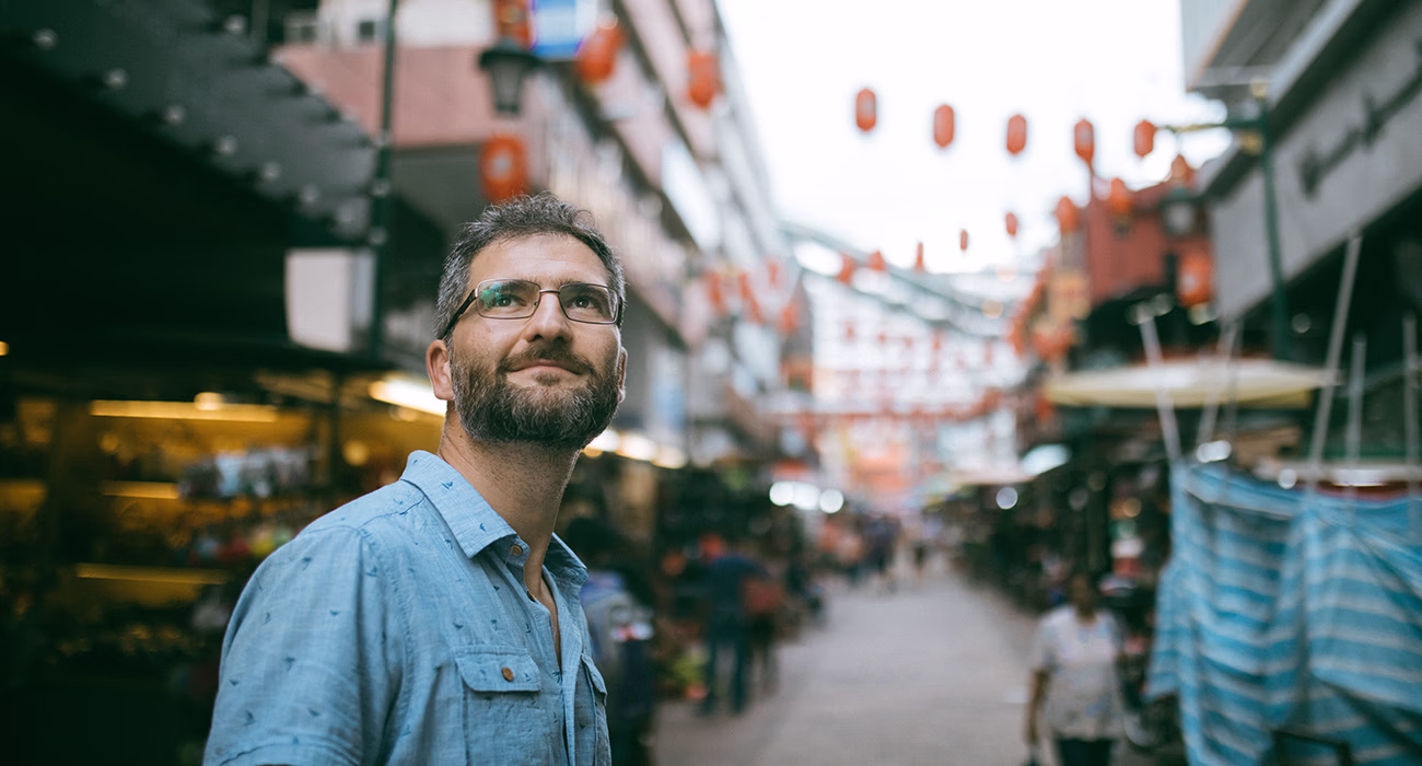adult man standing at the Jalan Petaling market, Kuala Lumpur, Malaysia