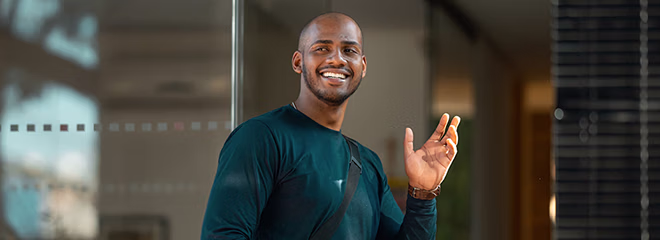 office employee waving goodbye